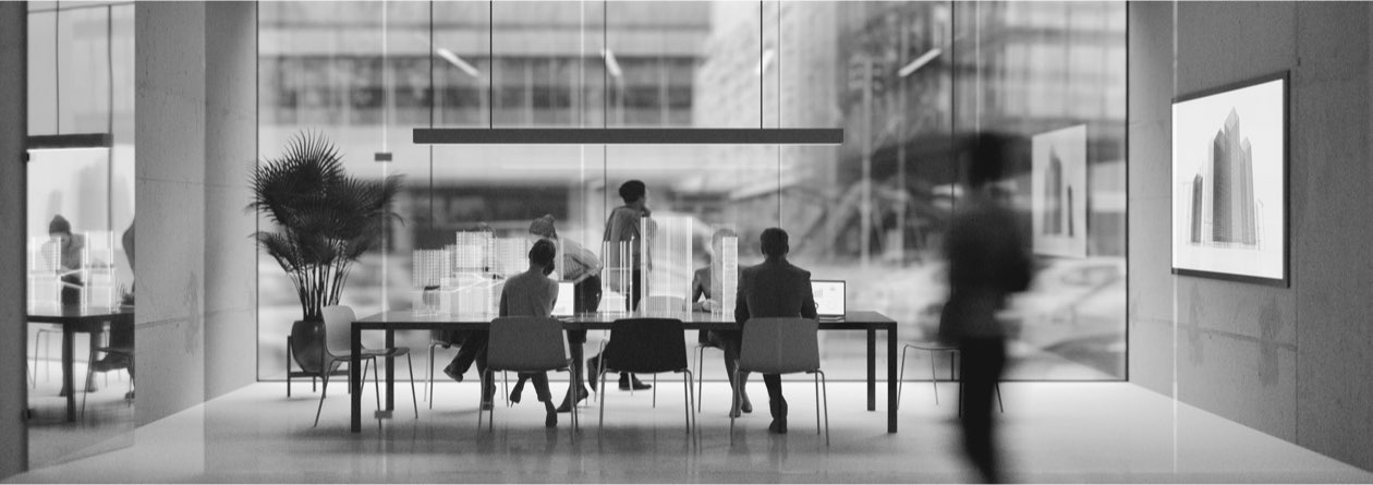 Office scene with people collaborating at a table
